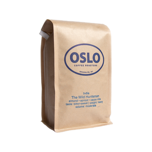 Side view of a Wild Huntsman coffee bag featuring Oslo Coffee Roasters logo and coffee product information