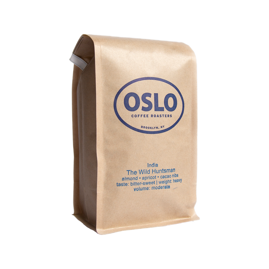 Side view of a Wild Huntsman coffee bag featuring Oslo Coffee Roasters logo and coffee product information